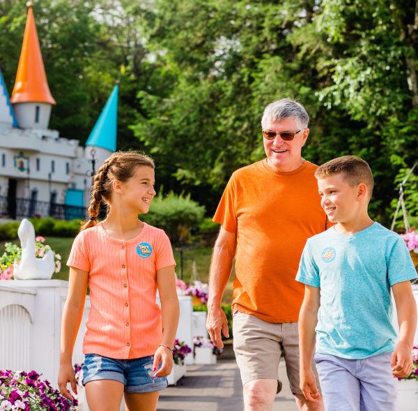 Grandfather and grandkids with castle in background